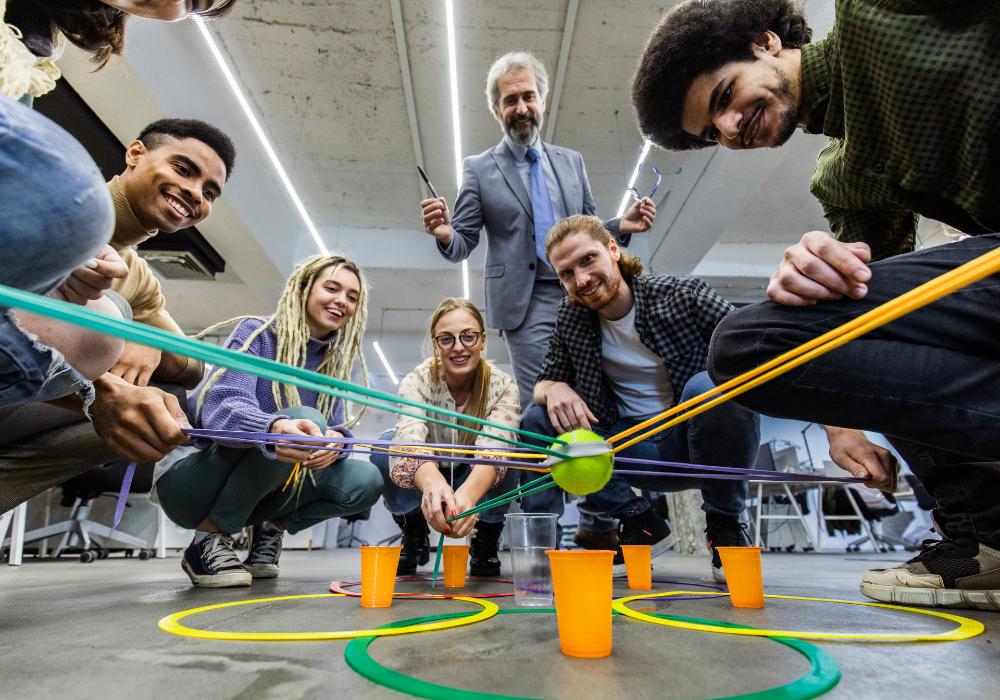 Employees participating in a facilitated team-building activity